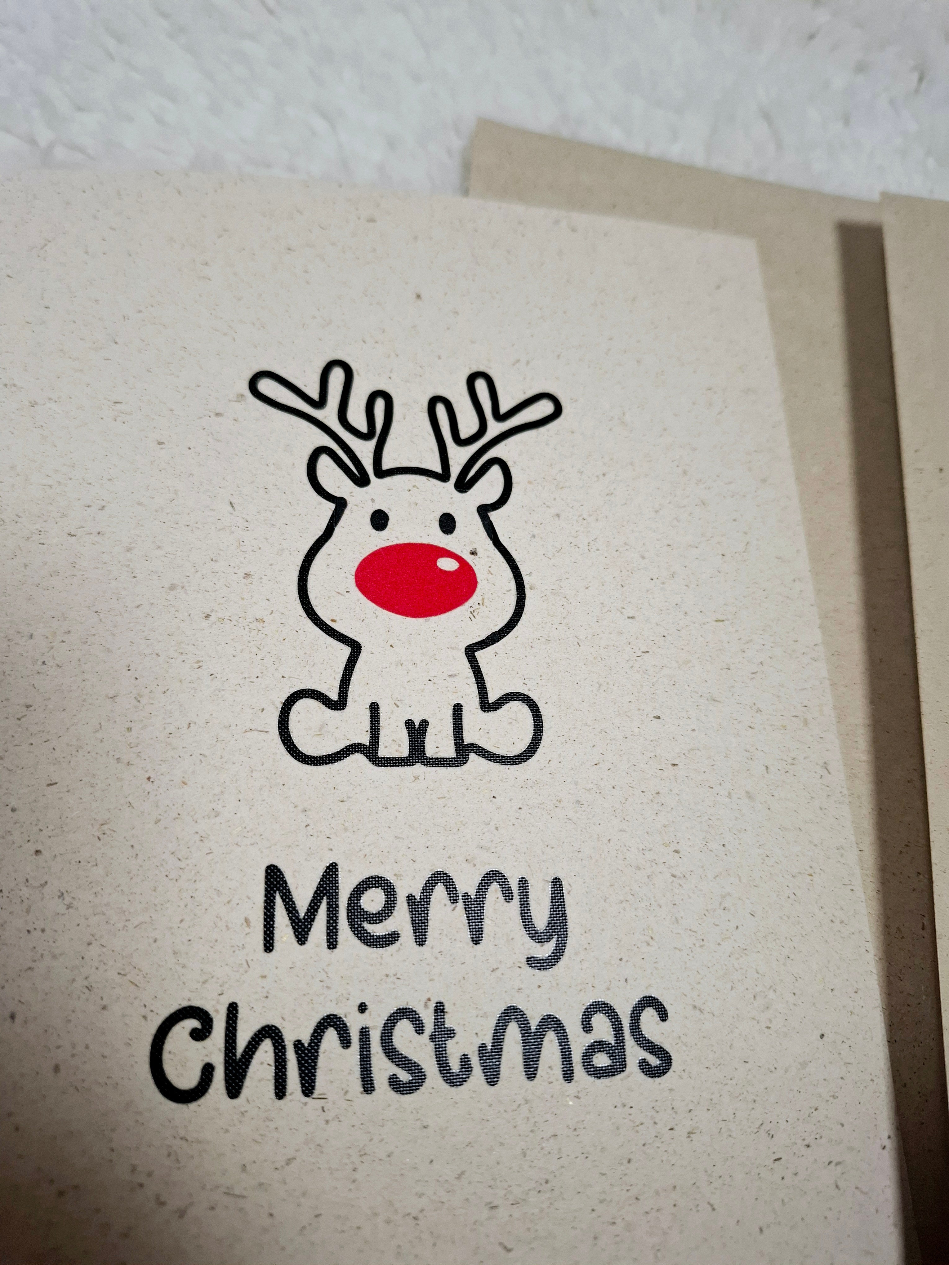 Grußkarte im A5-Format, dekoriert mit einem Rentier und dem Wunsch "Frohe Weihnachten".
