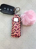 Stylisches Schlüsselband aus Neopren mit Lippenstifthalter & Pom Pom – Animalprint in Rosa/Pink - AC Designs