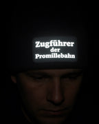 Zugführer der Promillebahn – Schwarze Mütze mit Reflex-Patch für Kohlfahrt & Party - AC Designs